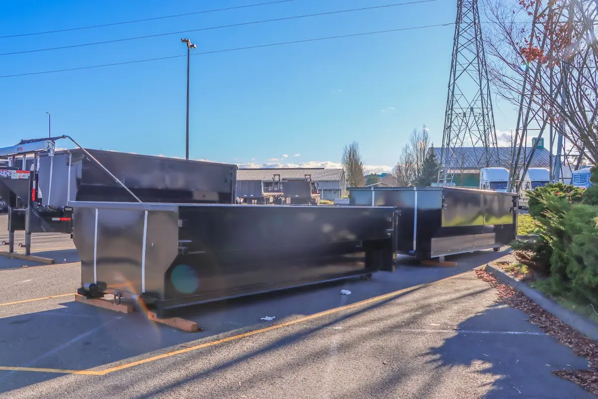 Roll-off dumpster ready for waste disposal at job site for 4 Yard Dumpster Rental in Wixom